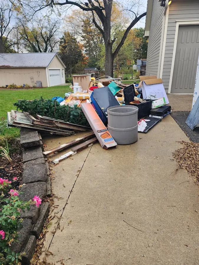 Dumpster being loaded with debris for Commercial Dumpster Rental in Cooper City